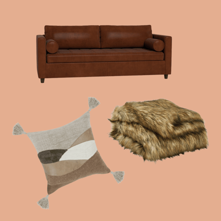 a brown leather sofa with a faux fur throw and a brown, linen accent pillow