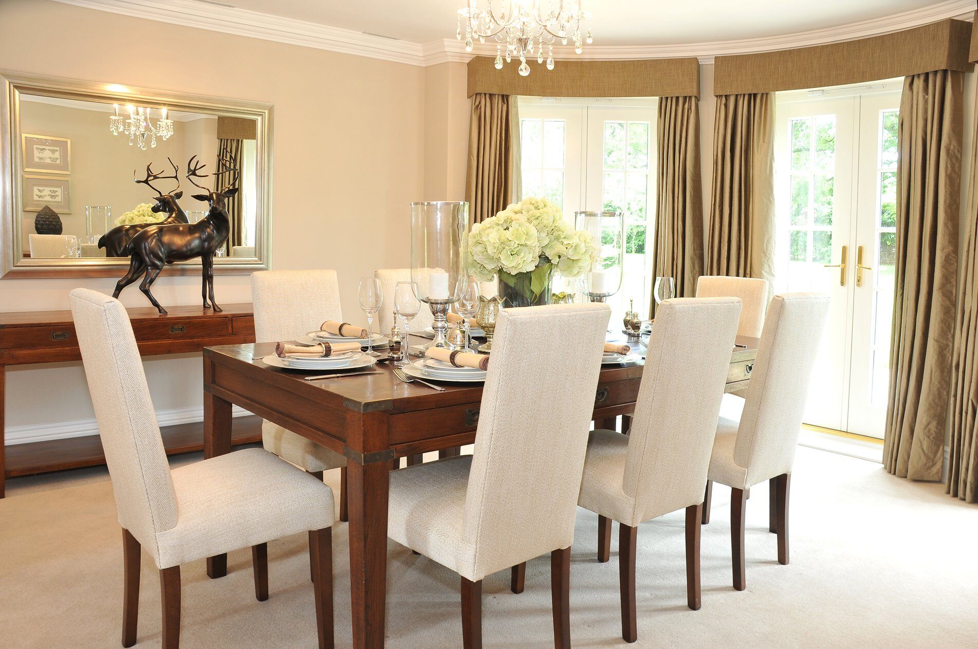 wood dining room table with white chairs 